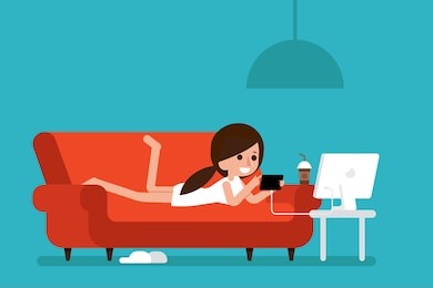 freelancer working at home with taplet on cozy sofa.