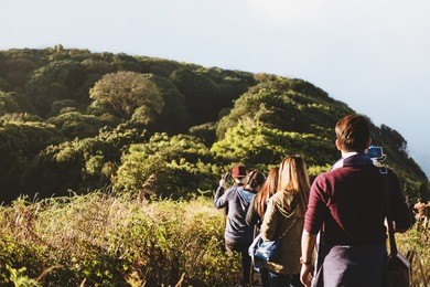 group of people walking on mountain in morning sunrise, trekking on the kew mae parn, national park mountain 