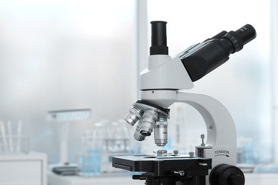 laboratory lens of microscope isolated blue scientific research background
