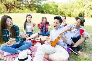 happy young  group enjoying  picnic party 