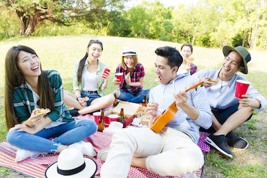happy young friends group enjoying  picnic party 