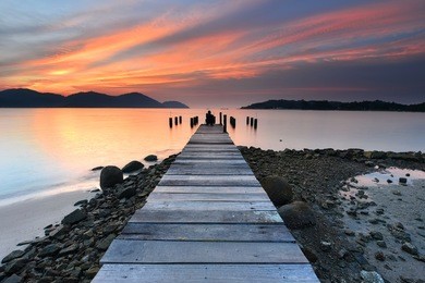 beautiful sunset view with wooden jetty at marina island, lumut perak malaysia. nature composition.