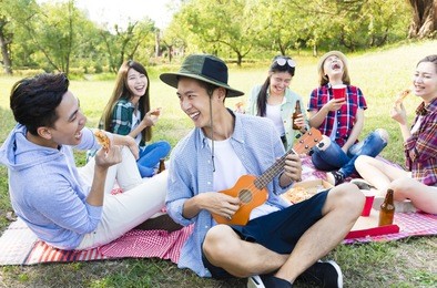 happy young  group enjoying  picnic party 