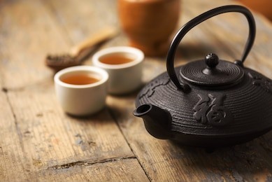 traditional japanese herbal tea recipe prepared in cast iron teapot with organic dry herbs. 