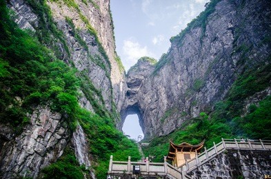 heavens door and pavilion at tianmenshan or mount tianmen in the city of zhangjiajie located in hunan province china.