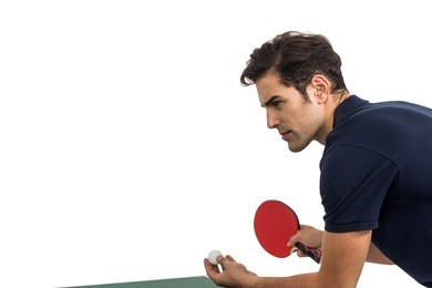 confident male athlete playing table tennis on white background