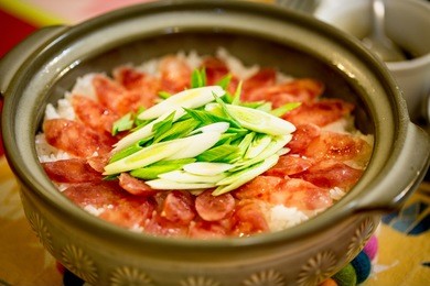 homemade clay pot sausages rice bowl. hong kong style clay pot rice bowl with sausages and garlic.chinese style.