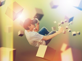 visual reality concept.young asian man using visual reality or vr headset man getting experience using vr-headset glasses.