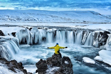adventurous man at godafoss on iceland