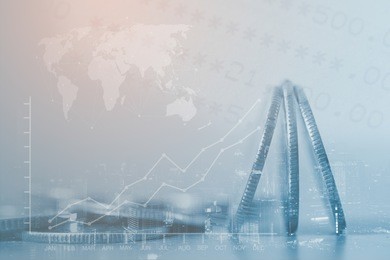 double exposure of close up coins and city night with business success or graphics of world economic growth report for finance and banking background