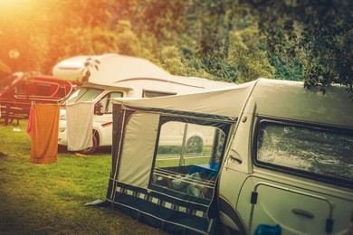 summer rv camper camping. relaxing on the campground. 