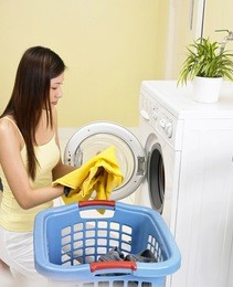 woman in front of the washing machine
