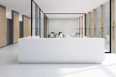 white reception desk standing in an office with glass walls. there are desks with computers in the background. 3d rendering. mock up.