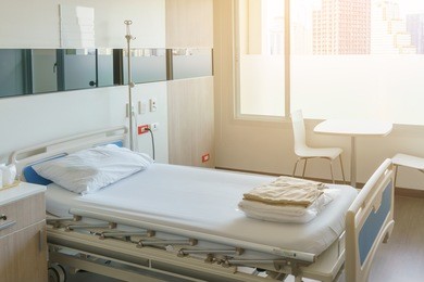 modern luxury hospital room with bed and medical equipment
