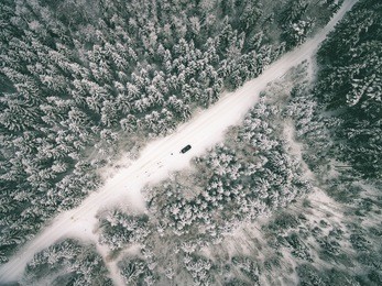 aerial view of winter forest covered in snow. drone photography - vintage effect