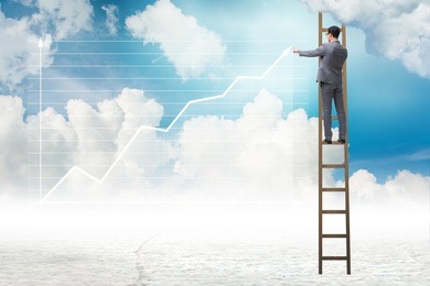 businessman drawing charts in the sky