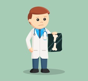 doctor holding broken bone x-ray