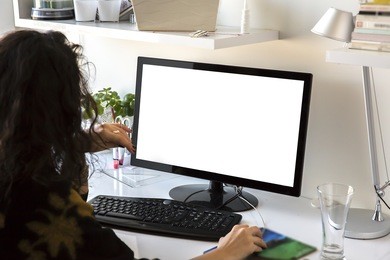 closeup image of woman's hands keyboarding blank copy space screen for your text message or advertising content, young female writing letter or e-mail on desktop computer to her friend