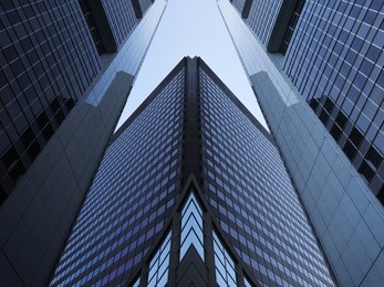 skyscraper / multistory office building in downtown business district. reworked photo of modern architecture. commercial real estate