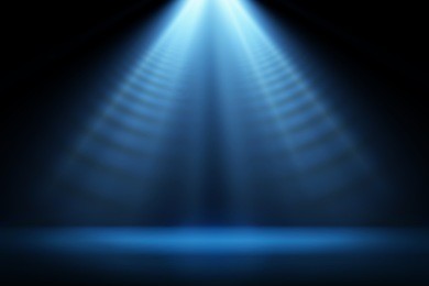 stage light and blue glitter lights on floor. abstract background for display your product. spotlight realistic ray