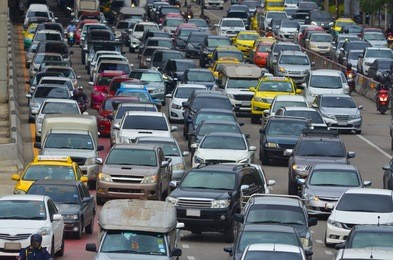 cars in traffic jam in a city during rush hour