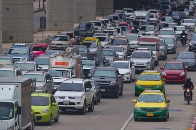 cars in traffic jam in a city during rush hour