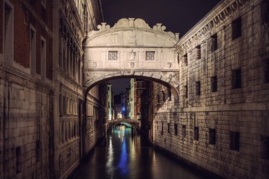 famous bridge of sighs (ponte dei sospiri) landmark at night, venice (venezia), italy, europe, vintage filtered style
