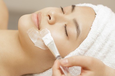 pampering for your skin. close up of a beautiful asian woman relaxing during spa facial treatment at the beauty center facial care mask skin recreation relaxation resort therapy treatment beauty 