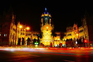 chhatrapati shivaji maharaj terminus (csmt), formerly victoria terminus, is a historic railway station and a unesco world heritage site in mumbai, maharashtra, india. night time. light trail photo.