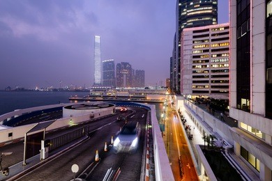 skyscrapers and mall at the tsim sha tsui district in hong kong at night. 