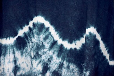 blurred tie dyed pattern on cotton fabric for background
