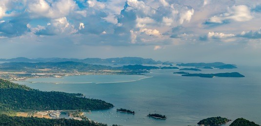 panoramic view of blue sky, sea and mountain seen from cable car viewpoint, langkawi, malaysia. picturesque landscape with beaches, small islands and tourist ships at waters of strait of malacca