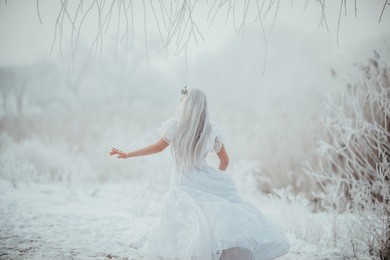 white fairytale princess in frozen world. vintage wedding dress. winter fantasy.