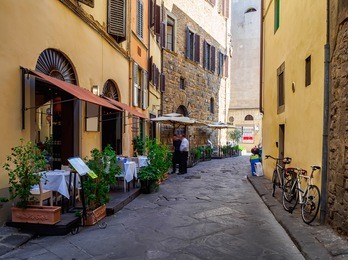 narrow street in florence, tuscany, italy. architecture and landmark of florence. cozy florence cityscape
