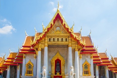 the marble temple, wat benchamabophit dusitvanaram with blue sky background , bangkok thailand