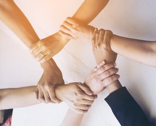 people hand assemble business partnership corporate meeting teamwork concept.top view.dramatic moment.split tone instragram like process with light. 