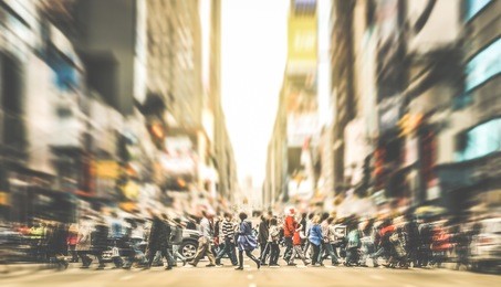 people walking on zebra crossing on 7th avenue in manhattan - crowded streets of new york city during rush hour in urban business area - retro desaurated contrast filter with soft sharpness and focus