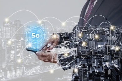 double exposure businessman using smartphone with 5g network and city overlay background with connected line