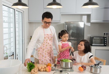 asian family cooking at kitchen