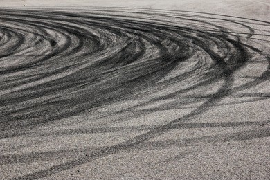 the rubber tracks from the rallye cars left on the tarmac in the hairpin. 