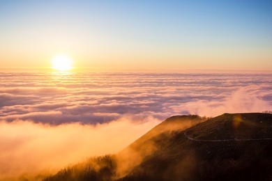 beautiful sunset, clouds and mountains. on high