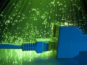 network cable and hub closeup with fiber optical background
