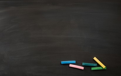 abstract chalk rubbed out on blackboard for background. texture for add text or graphic design. education concepts school.