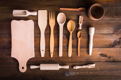 kitchen utensils on wooden background