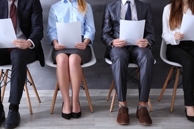 group of young people waiting for interview indoors