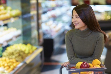 one young chinese woman shopping in the supermarket