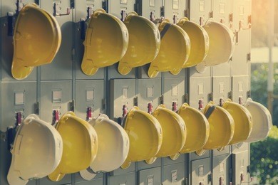 safety helmet hanging on locker for worker equipment