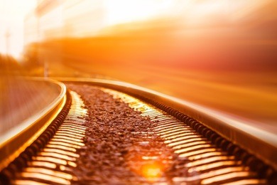 railroad in motion at sunset.