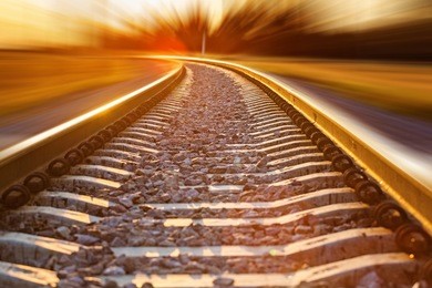 railroad in motion at sunset.