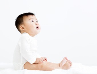 adorable asian   smiling  baby  boy looking up